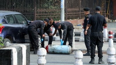 National Security Guard (NSG) team investigates the CNG cylinder near the site of the blast, which occurred in a Hyundai i20 car near Gate no 1 of the Red Fort Metro station, in New Delhi on Tuesday. (Naveen Sharma/ANI) National Security Guard (NSG) team investigates the CNG cylinder near the site of the blast, which occurred in a Hyundai i20 car near Gate no 1 of the Red Fort Metro station, in New Delhi on Tuesday. (Naveen Sharma/ANI)