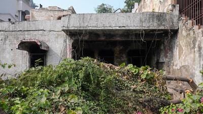 During a spot check, HT found that the overgrown shrubs and creepers of the infamous D-5 bungalow had been removed, and now the crumbling walls are clearly visible. (Sunil Ghosh/HT Photo) During a spot check, HT found that the overgrown shrubs and creepers of the infamous D-5 bungalow had been removed, and now the crumbling walls are clearly visible. (Sunil Ghosh/HT Photo)