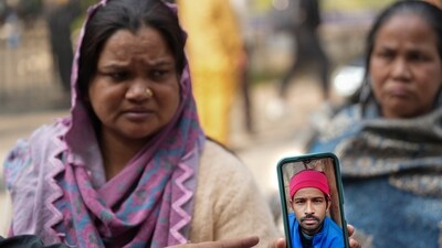 A family member of Jumman, an e-rickshaw driver who died in the blast near Red Fort, shows a picture of the deceased, in New Delhi, Tuesday, Nov. 11, 2025. (PTI) A family member of Jumman, an e-rickshaw driver who died in the blast near Red Fort, shows a picture of the deceased, in New Delhi, Tuesday, Nov. 11, 2025. (PTI)