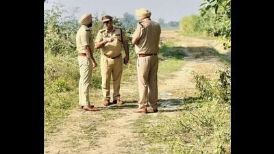 Police at the site of the encounter in Khan Khana on Tuesday. (HT Photo)