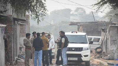 Police officers during a cordon and search operation at Fatehpur Taga village in Faridabad on Monday. (Subhash Sharma/HT)