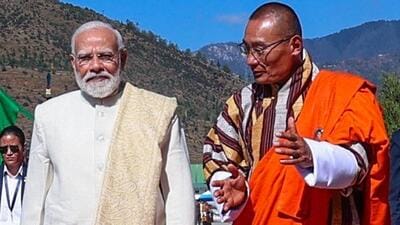 Prime Minister Narendra Modi welcomed by Bhutan's Prime Minister Tshering Tobgay on his arrival in Thimphu on Tuesday. (DPR PMO/ via ANI) Prime Minister Narendra Modi welcomed by Bhutan's Prime Minister Tshering Tobgay on his arrival in Thimphu on Tuesday. (DPR PMO/ via ANI)