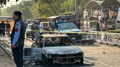 Policemen examine damaged vehicles after a suicide blast outside the district court in Islamabad on November 11, 2025. (AFP) Policemen examine damaged vehicles after a suicide blast outside the district court in Islamabad on November 11, 2025. (AFP)