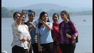 Visitors enjoying at Sukhna Lake in Chandigarh on Tuesday. (Keshav Singh/HT)