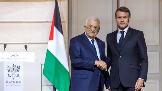French President Emmanuel Macron, right, shakes hands with Palestinian President Mahmoud Abbas after a joint statement at the Elysee Palace in Paris, Tuesday Nov. 11 2025. (AP)