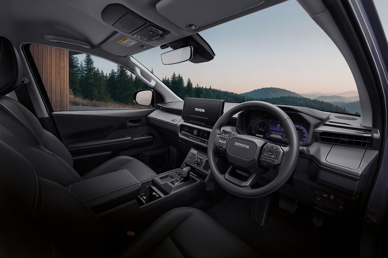The interior of the Hilux BEV carries style cues from the Land Cruiser and features a horizontal dashboard layout with twin digital screens The interior of the Hilux BEV carries style cues from the Land Cruiser and features a horizontal dashboard layout with twin digital screens
