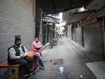 Shops seen closed as security officials carry out investigation on the spot where an alleged blast took place in a car yesterday outside Red Fort in Delhi, on Tuesday. (Sanchit Khanna/HT Photo)