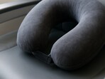 A travel neck pillow that makes every economy flight feel softer, calmer and perfect for catching some real rest.(AI generated)