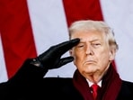 Donald Trump salutes during a Veterans Day ceremony at Arlington National Cemetery.