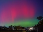 Northern Lights, also called aurora borealis, illuminate the night sky in Johnston, Iowa, U.S., November 11, 2025,