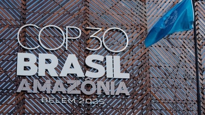 A United Nations flag is near the logo for the COP30 UN Climate Summit on Monday. (AP)