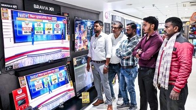 People watch exit polls on TV sets at a showroom after the second phase of the Bihar assembly elections, in Patna on Tuesday. (ANI/Pappi Sharma) People watch exit polls on TV sets at a showroom after the second phase of the Bihar assembly elections, in Patna on Tuesday. (ANI/Pappi Sharma)