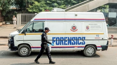 A national security guard (NSG) personnel walks past a forensic van that stands stationed near the exit of the Lal Qila metro station, where the explosion on Monday claimed at least 10 lives, and injured several others. (Naveen Sharma/ANI) A national security guard (NSG) personnel walks past a forensic van that stands stationed near the exit of the Lal Qila metro station, where the explosion on Monday claimed at least 10 lives, and injured several others. (Naveen Sharma/ANI)