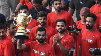Virat Kohli and RCB players present the IPL trophy to the Bengaluru fans. (AFP) Virat Kohli and RCB players present the IPL trophy to the Bengaluru fans. (AFP)
