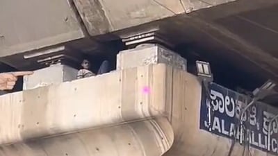 A man was found sleeping inside a hollow flyover pillar in Bengaluru, attracting online attention and baffling commuters. A man was found sleeping inside a hollow flyover pillar in Bengaluru, attracting online attention and baffling commuters.