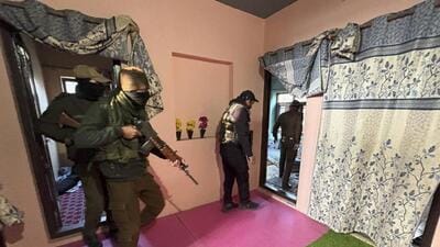 Security personnel during a crackdown on the banned Jamaat-e-Islami (JeI), in Kulgam on Wednesday. (PTI Photo) Security personnel during a crackdown on the banned Jamaat-e-Islami (JeI), in Kulgam on Wednesday. (PTI Photo)