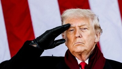 Donald Trump salutes during a Veterans Day ceremony at Arlington National Cemetery. (REUTERS)