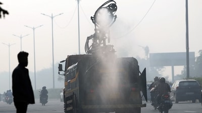 An anti-smog gun was seen spraying water in the national capital to curb air pollution. (ANI) An anti-smog gun was seen spraying water in the national capital to curb air pollution. (ANI)
