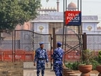 Rapid Action Force (RAF) stand guard at the Red Fort car blast site, in New Delhi on Wednesday. 
