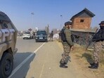 Armed personnel keeping vigil along the Jammu-Srinagar National Highway following the Delhi bomb blast, in Anantnag on Thursday. (PTI Photo)