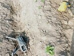 BSF personnel with the DJI Mavic 3 Classic drone, along with a packet of heroin, recovered from a field near Habibwala village in Ferozepur district on Thursday. (HT Photo)