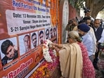 People pay tribute to victims of the blast near Red Fort, at Sarojini Nagar Market in New Delhi on Thursday. 