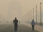People jog at Kartavya Path amid dense smog as the AQI reaches ‘severe’ category in New Delhi. (ANI)