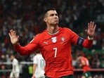 Cristiano Ronaldo gestures to fans as he celebrates a goal for Portugal.