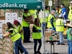 CITY OF INDUSTRY, CALIFORNIA - NOVEMBER 05: Workers and volunteers help distribute food boxes to those in need at a large-scale drive-through food distribution, in response to the federal government shutdown and SNAP/CalFresh food benefits delays, on November 5, 2025 in City of Industry, California. The event was hosted by the Los Angeles Regional Food Bank and L.A. County Supervisor Hilda Solis. (Photo by MARIO TAMA / GETTY IMAGES NORTH AMERICA / Getty Images via AFP) CITY OF INDUSTRY, CALIFORNIA - NOVEMBER 05: Workers and volunteers help distribute food boxes to those in need at a large-scale drive-through food distribution, in response to the federal government shutdown and SNAP/CalFresh food benefits delays, on November 5, 2025 in City of Industry, California. The event was hosted by the Los Angeles Regional Food Bank and L.A. County Supervisor Hilda Solis. (Photo by MARIO TAMA / GETTY IMAGES NORTH AMERICA / Getty Images via AFP)