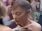 Ariana Grande looked shocked as a fan charged on her at the event.