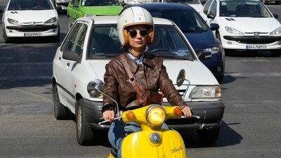 Merat Behnam drives her motorbike in Tehran on November 1, 2025. (AP) Merat Behnam drives her motorbike in Tehran on November 1, 2025. (AP)