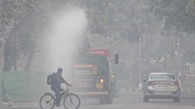 An anti-smog gun sprays water to curb air pollution, in Delhi, on Thursday. (PTI) An anti-smog gun sprays water to curb air pollution, in Delhi, on Thursday. (PTI)