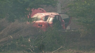 A red Ford EcoSport car suspected to be linked to the Delhi Red Fort blast case has been traced in Faridabad district's Khandawali, (PTI) A red Ford EcoSport car suspected to be linked to the Delhi Red Fort blast case has been traced in Faridabad district's Khandawali, (PTI)