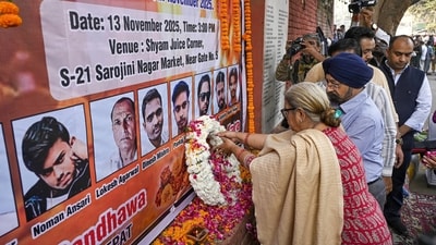 People pay tribute to victims of the blast near Red Fort, at Sarojini Nagar Market in New Delhi on Thursday. (PTI) People pay tribute to victims of the blast near Red Fort, at Sarojini Nagar Market in New Delhi on Thursday. (PTI)