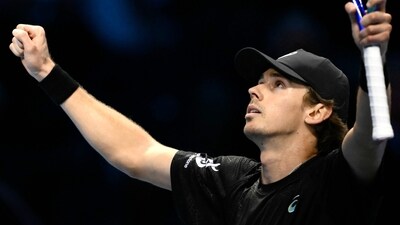 Australia's Alex De Minaur celebrates after winning against USA's Taylor Fritz at the ATP Finals tennis tournament in Turin on November 13 (AFP)