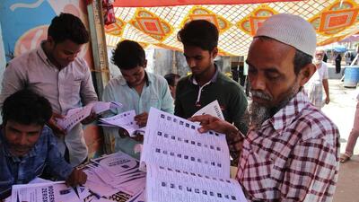 Thane, India- 24 May 2017 :Voters searching their name in voter list at Nijampura polling booth for Bhiwandi-Nijampura corporation election at Bhiwandi in Thane, India on Wednesday May 24 2017.(Photo by Praful Gangurde/Hindustan Times) (Praful Gangurde) Thane, India- 24 May 2017 :Voters searching their name in voter list at Nijampura polling booth for Bhiwandi-Nijampura corporation election at Bhiwandi in Thane, India on Wednesday May 24 2017.(Photo by Praful Gangurde/Hindustan Times) (Praful Gangurde)