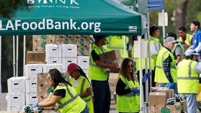 CITY OF INDUSTRY, CALIFORNIA - NOVEMBER 05: Workers and volunteers help distribute food boxes to those in need at a large-scale drive-through food distribution, in response to the federal government shutdown and SNAP/CalFresh food benefits delays, on November 5, 2025 in City of Industry, California. The event was hosted by the Los Angeles Regional Food Bank and L.A. County Supervisor Hilda Solis. (Photo by MARIO TAMA / GETTY IMAGES NORTH AMERICA / Getty Images via AFP) (Getty Images via AFP) CITY OF INDUSTRY, CALIFORNIA - NOVEMBER 05: Workers and volunteers help distribute food boxes to those in need at a large-scale drive-through food distribution, in response to the federal government shutdown and SNAP/CalFresh food benefits delays, on November 5, 2025 in City of Industry, California. The event was hosted by the Los Angeles Regional Food Bank and L.A. County Supervisor Hilda Solis. (Photo by MARIO TAMA / GETTY IMAGES NORTH AMERICA / Getty Images via AFP) (Getty Images via AFP)