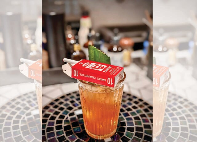 At Goa’s MTW Bar, the Chai Break cocktail is served with a pack of cigarette candies. At Goa’s MTW Bar, the Chai Break cocktail is served with a pack of cigarette candies.