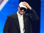 Bad Bunny accepts the award for record of the year during the 2025 Latin Grammys on Thursday.(Chris Pizzello/Invision/AP)