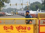 Rapid Action Force (RAF) stand guard at the Red Fort car blast site, in New Delhi on Friday. 