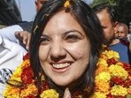 BJP’s Devyani Rana celebrates her victory in the Nagrota assembly byelection in Jammu district on Friday. (PTI Photo)