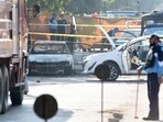 A police officer stands at the site of a blast outside a court building in Islamabad, Pakistan, The attack was claimed by a faction of the Pakistani Taliban, known as the Tehreek-e-Taliban Pakistan (TTP).