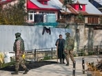 Security personnel interact with a local as they carry out a door-to-door census in connection with the "white-collar terror module" following the recent blast near Delhi's Red Fort, at Koil, in Pulwama district, Jammu and Kashmir. Security personnel interact with a local as they carry out a door-to-door census in connection with the "white-collar terror module" following the recent blast near Delhi's Red Fort, at Koil, in Pulwama district, Jammu and Kashmir.