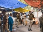 Security personnel examine the site of a car explosion near the Red Fort, in New Delhi on Thursday. (ANI) Security personnel examine the site of a car explosion near the Red Fort, in New Delhi on Thursday. (ANI)
