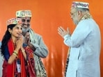 Maithili Thakur, BJP's Alinagar seat candidate, with home minister Amit Shah during a public rally for the Bihar assembly elections Maithili Thakur, BJP's Alinagar seat candidate, with home minister Amit Shah during a public rally for the Bihar assembly elections