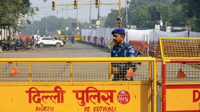 Rapid Action Force (RAF) stand guard at the Red Fort car blast site, in New Delhi on Friday. (ANI)