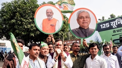Janata Dal (United) (JD-U) supporters hold placards of Prime Minister Narendra Modi and Bihar Chief Minister Nitish Kumar as they celebrate NDA's lead in the vote counting of the Bihar Assembly election 2025 at the party office, in Patna. (ANI Photo) (Aftab Alam Siddiqui) Janata Dal (United) (JD-U) supporters hold placards of Prime Minister Narendra Modi and Bihar Chief Minister Nitish Kumar as they celebrate NDA's lead in the vote counting of the Bihar Assembly election 2025 at the party office, in Patna. (ANI Photo) (Aftab Alam Siddiqui)