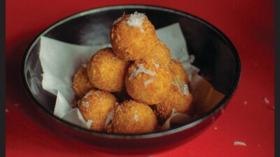 Adithya Kidambi has created refined versions of vintage bar food, such as cheese balls. Adithya Kidambi has created refined versions of vintage bar food, such as cheese balls.
