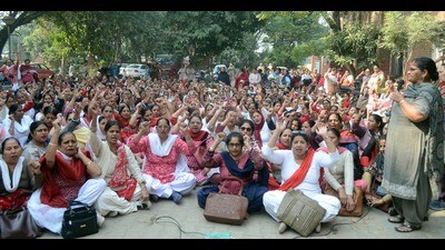 Anganwadi workers protesting outside the Child Development Project Office in Ludhiana on Friday. (Gurpreet Singh/HT)