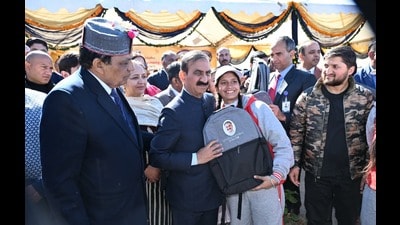 Himachal CM Sukhvinder Singh Sukhu handing over school bag to a student during an event on The Ridge on Friday. (Deepak Sansta/HT) Himachal CM Sukhvinder Singh Sukhu handing over school bag to a student during an event on The Ridge on Friday. (Deepak Sansta/HT)